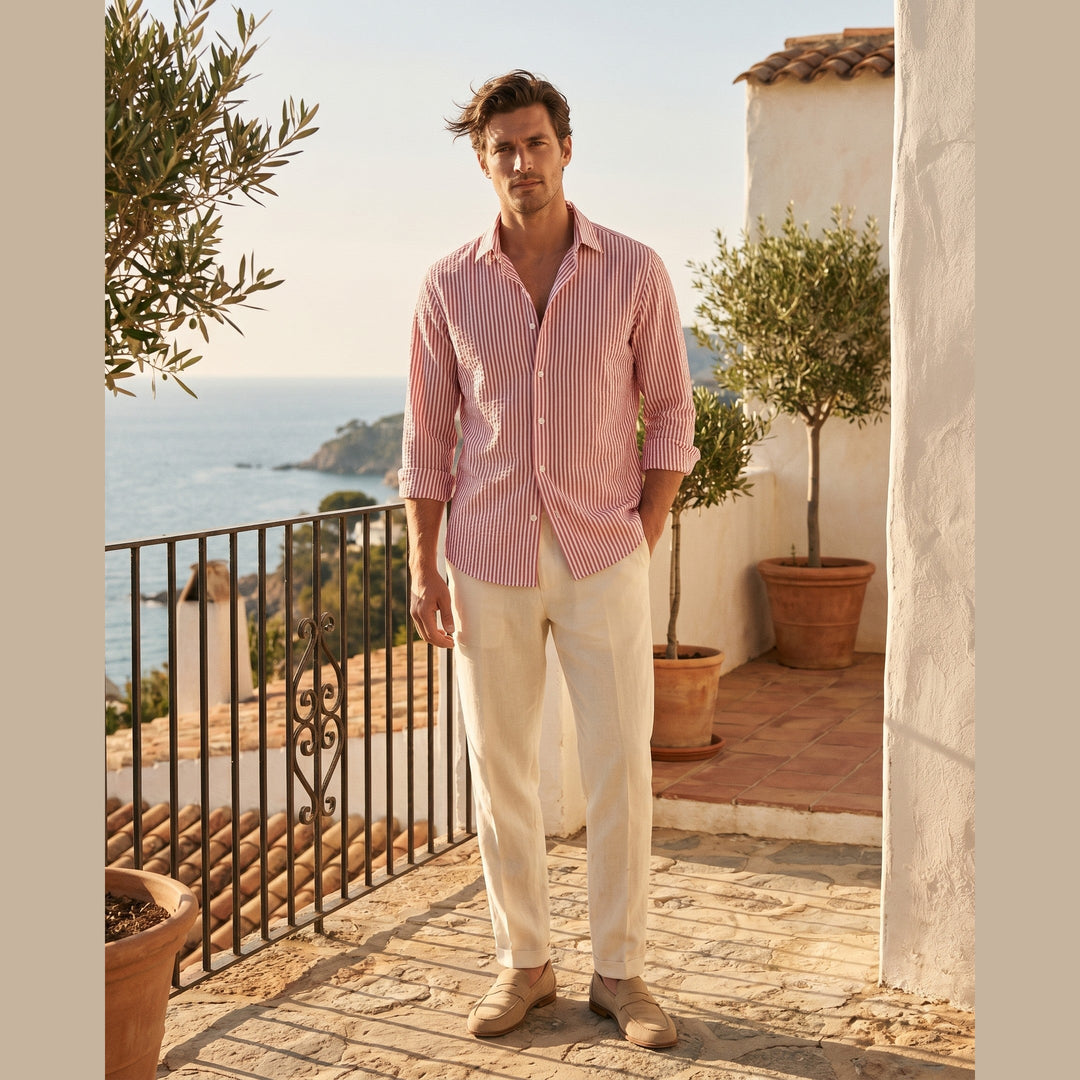 Man wearing the Marseille seersucker shirt on a sunlit terrace